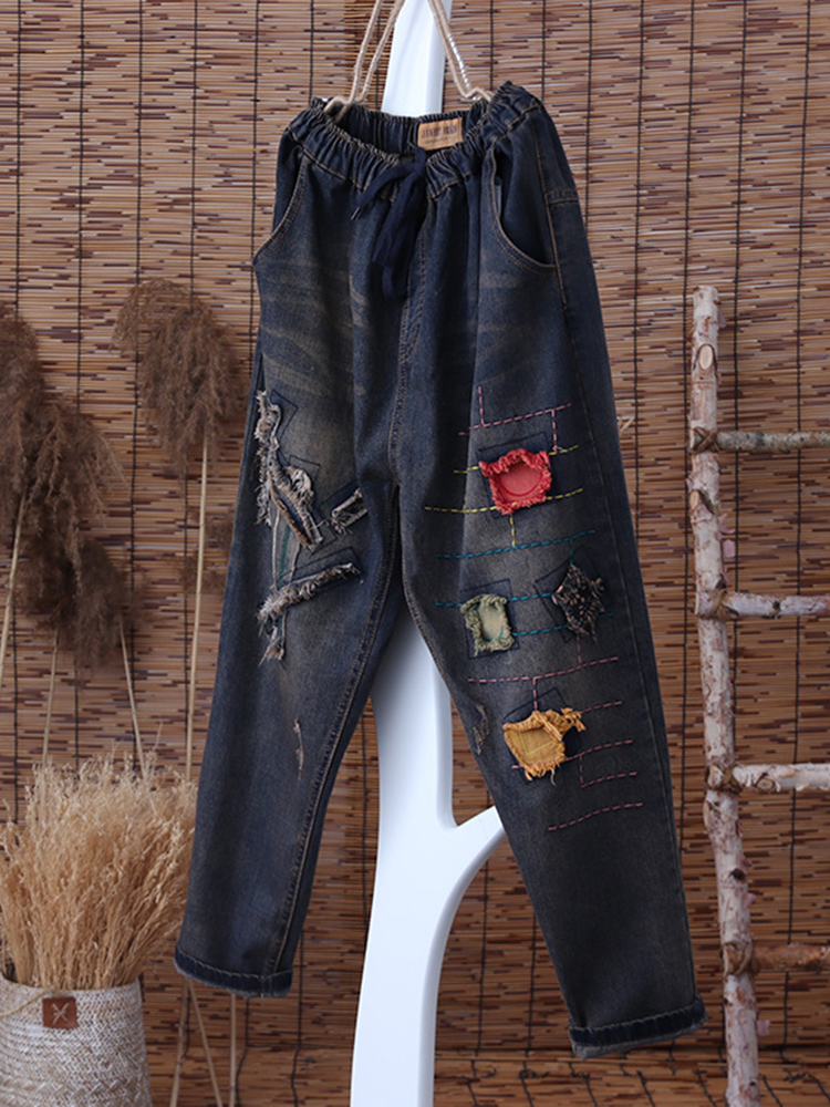 

Patch Embroidered Ripped Denim Jeans